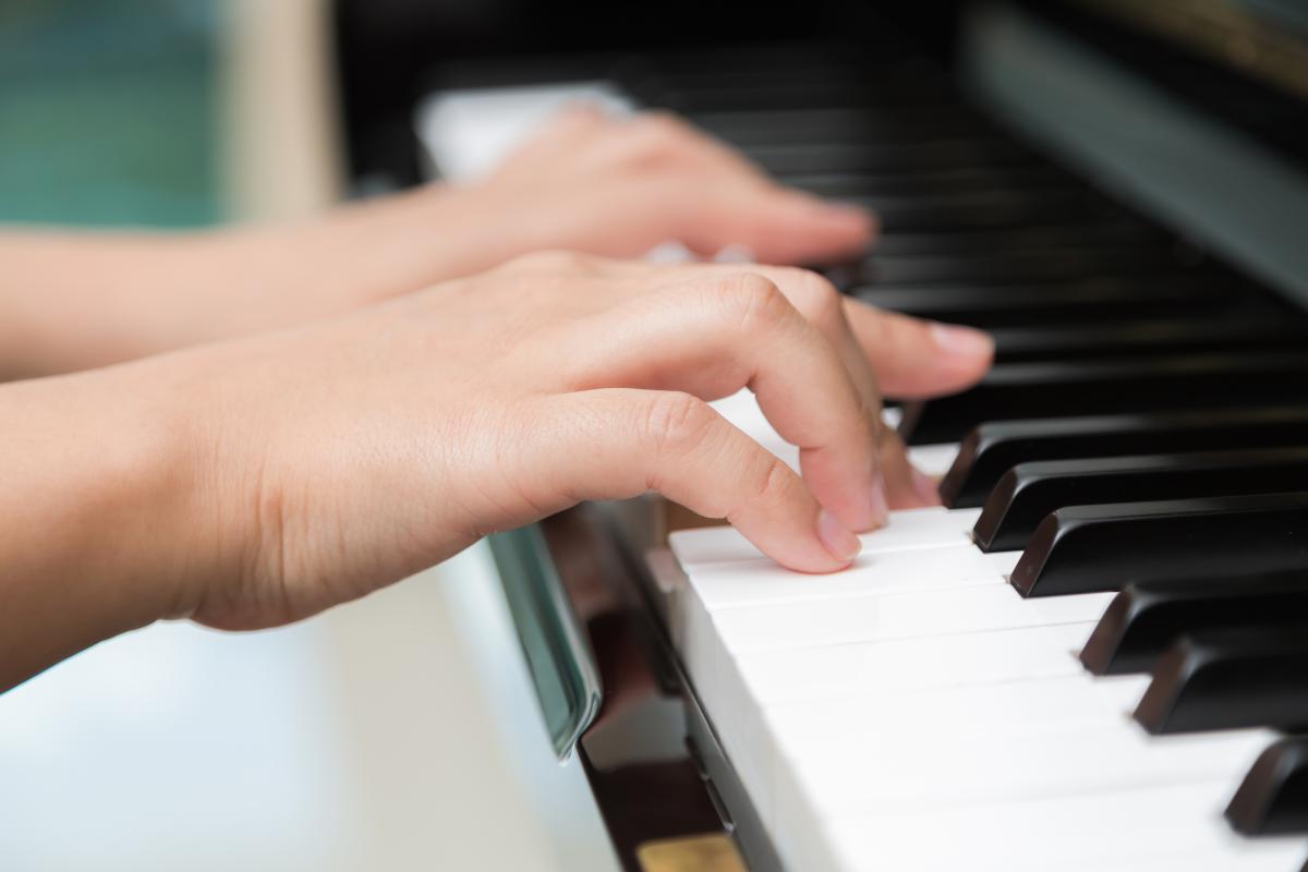 close-up-hands-playing-piano